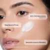 Revision Skincare® C+ Correct serum on a woman’s face if information about what to use it for.