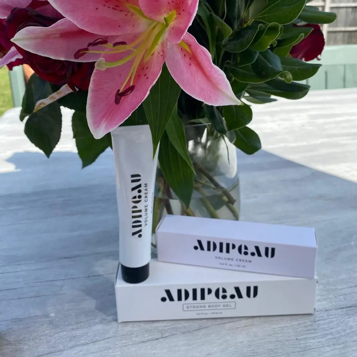 Adipeau Strength Gel and Adipeau Volume Cream as a pair on a table