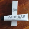 Adipeau Strength Gel and Packaging on a Table