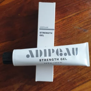 Adipeau Strength Gel and Packaging on a Table