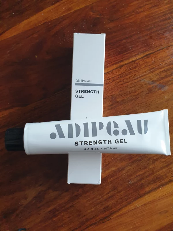 Adipeau Strength Gel and Packaging on a Table