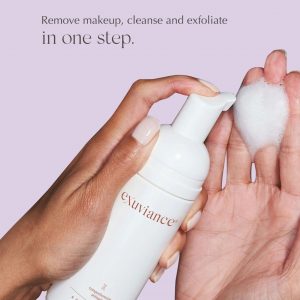 Rich creamy foam texture of Exuviance BioActiv Wash showing gentle bubbles