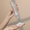 IDENEL Brightening-Skin_ liquid toner pouring onto cloth