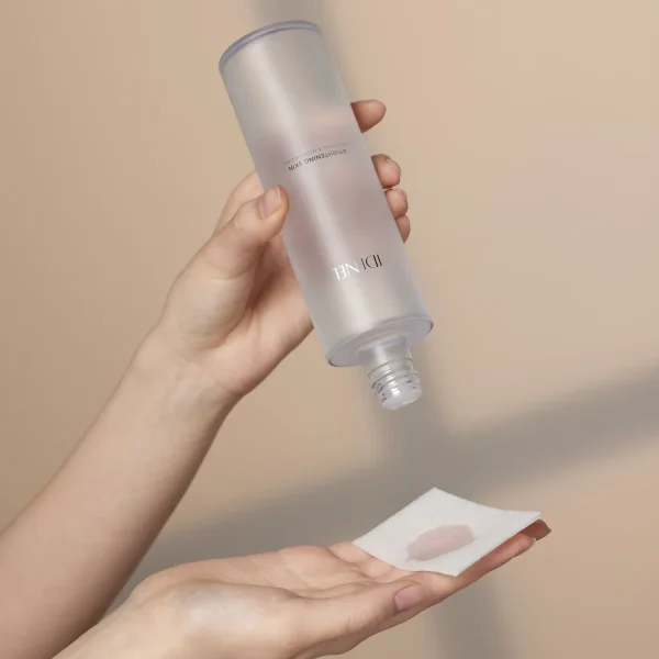 IDENEL Brightening-Skin_ liquid toner pouring onto cloth